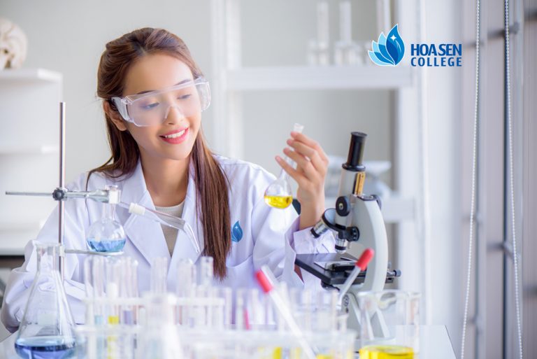 Young Asian scientist woman lab technical service holding flask with lab glassware and test tubes in chemical laboratory background, science laboratory research and development concept; Shutterstock ID 1772477714; other: -; purchase_order: -; client: -; job: -
